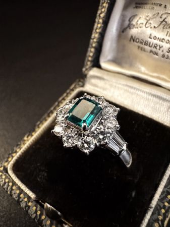 Platinum Ring with Emerald and Diamonds